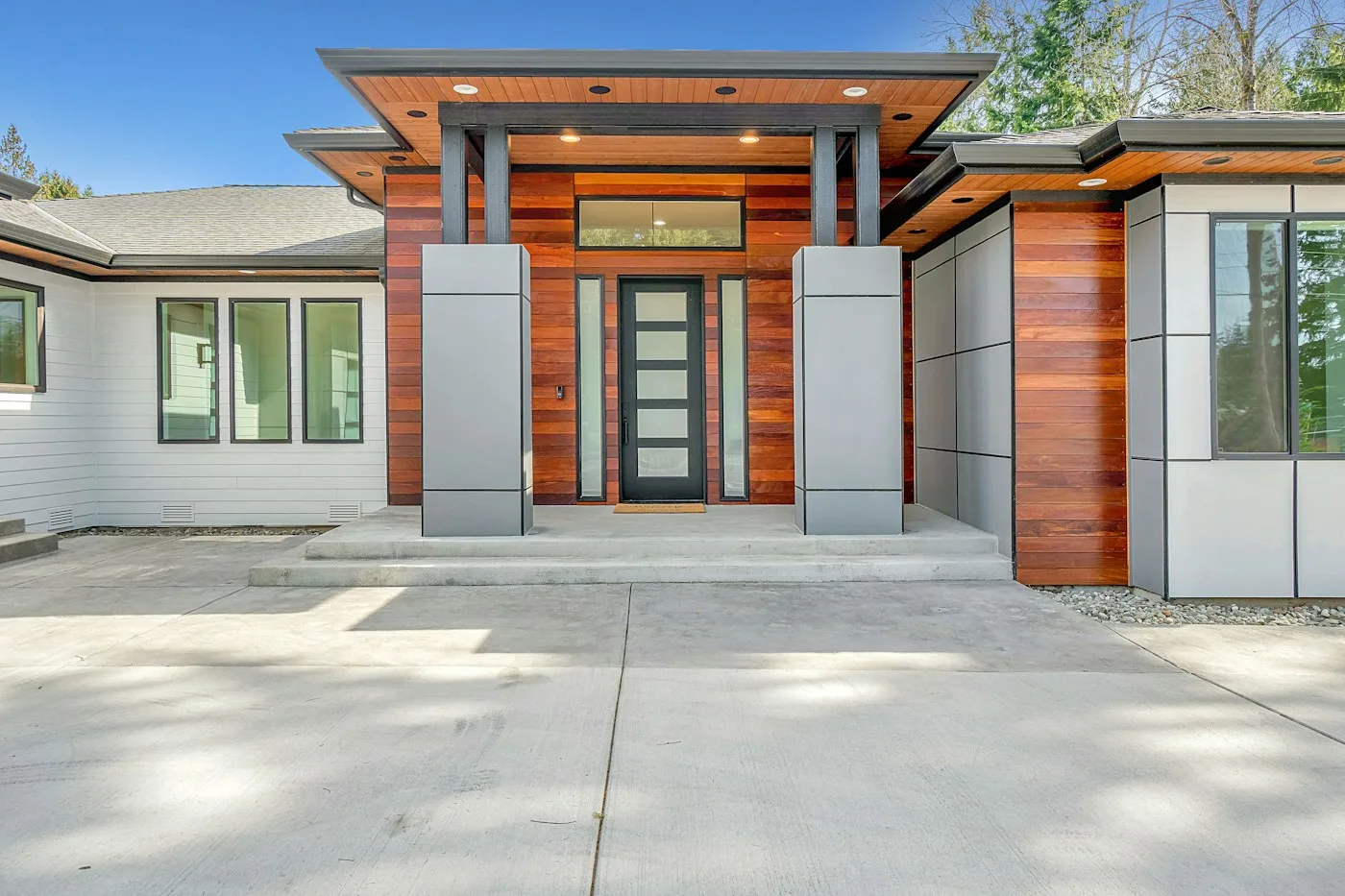 Contemporary home exterior with wood paneling