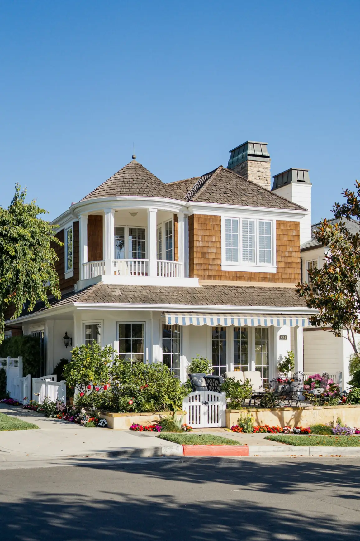 A large white house with a brown roof