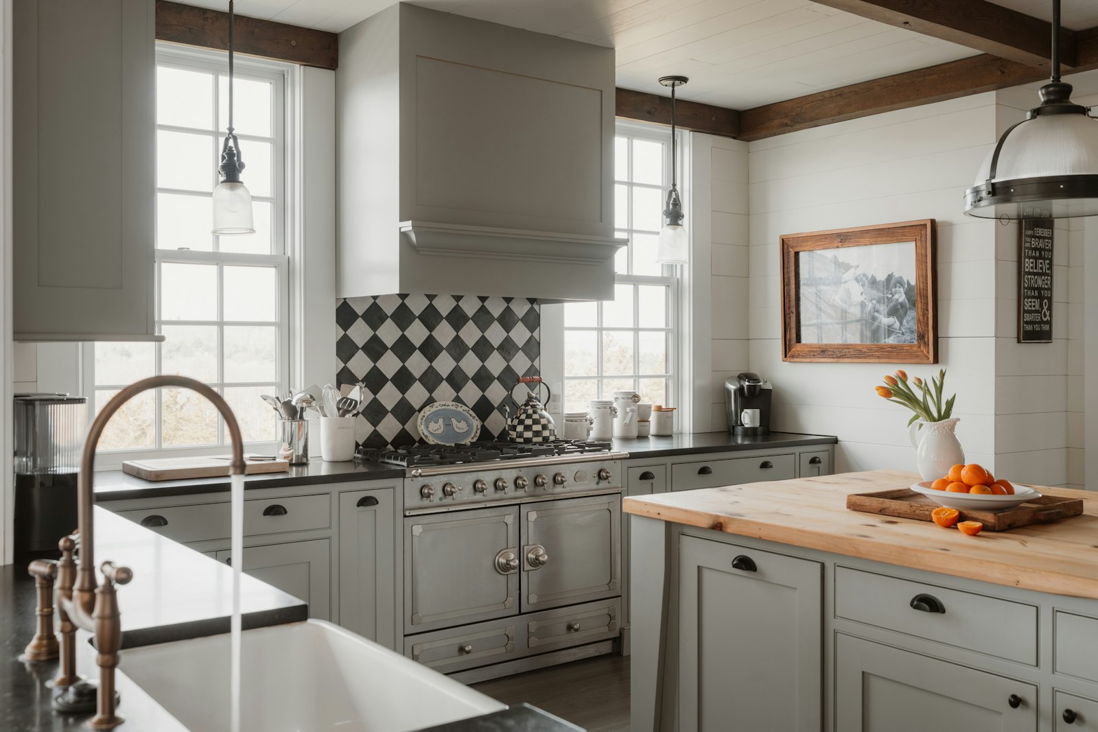 A modern farmhouse kitchen with gray cabinets and island