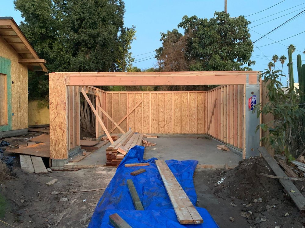 Precision wood framing and reinforced concrete slab for garage construction in Burbank