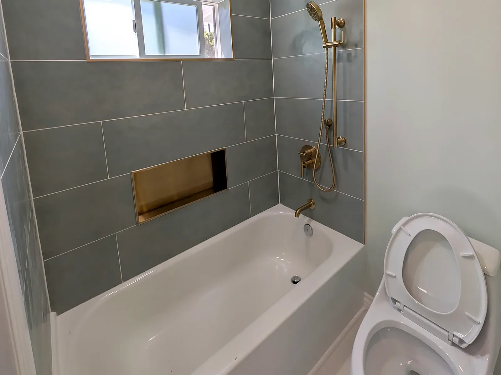Bathtub Tile and Gold Fixtures — Bathtub and Tile Remodel